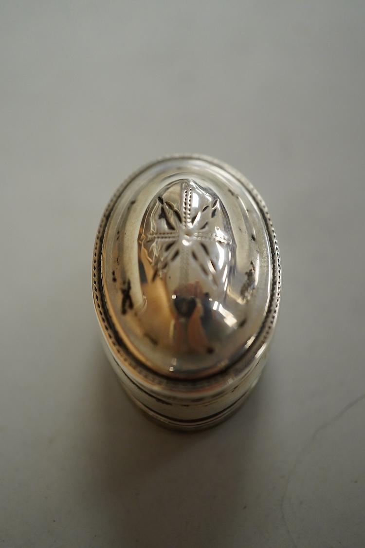 A George III silver oval nutmeg grater by Samuel Pemberton, Birmingham, date letter rubbed, 34mm.